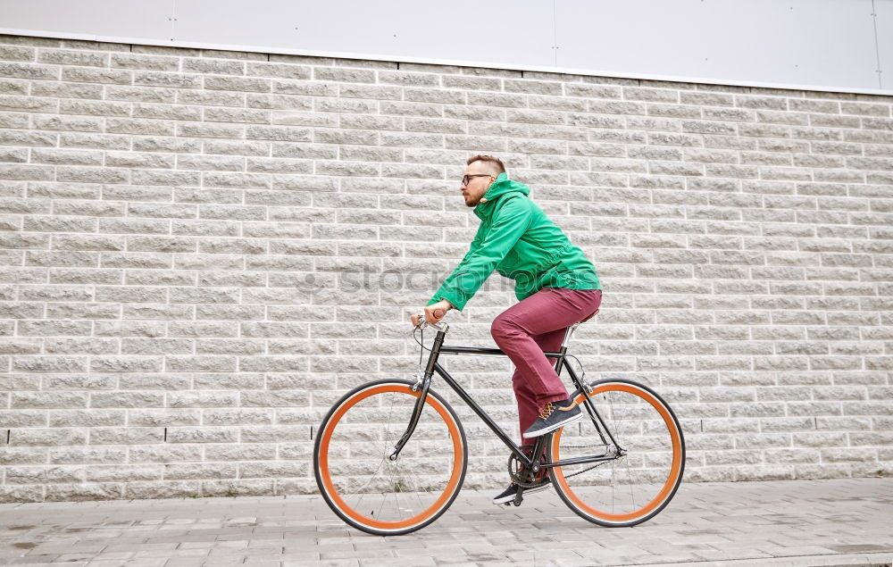 Similar – Image, Stock Photo Handsome young man on bike in the city.