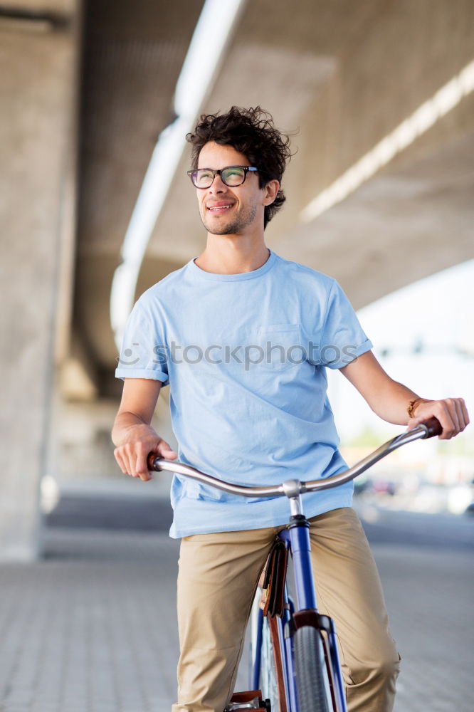 Similar – Image, Stock Photo Young man with mobile phone and fixed gear bicycle.