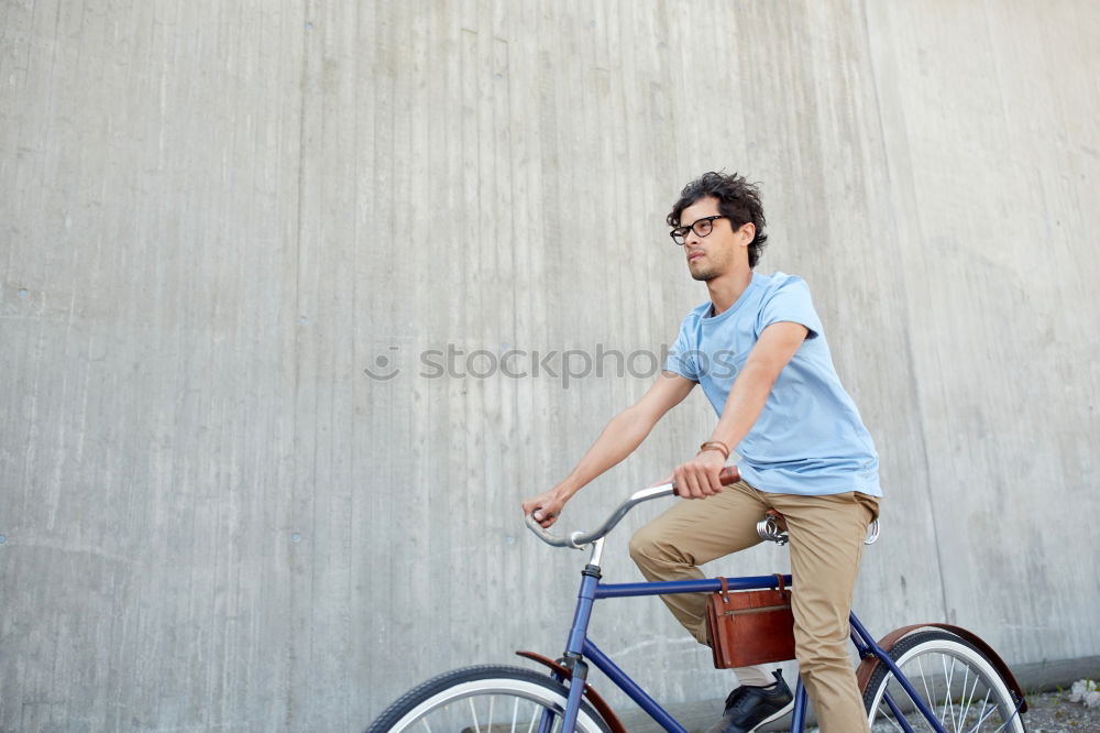 Image, Stock Photo Smiling man with sunglasses sitting at bicycle