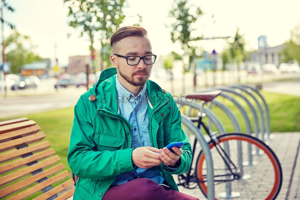 Similar – Image, Stock Photo Young man with mobile phone and fixed gear bicycle.