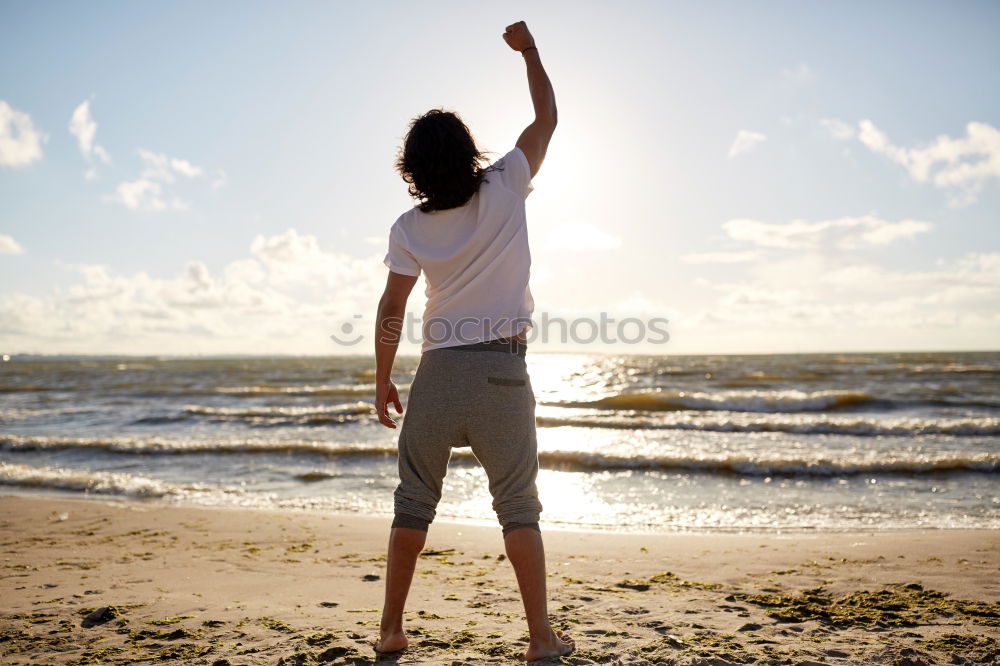 Similar – Father and daughter playing on the beach at the day time.