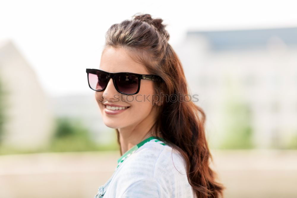 Similar – Young woman with eye glasses smiling in the street