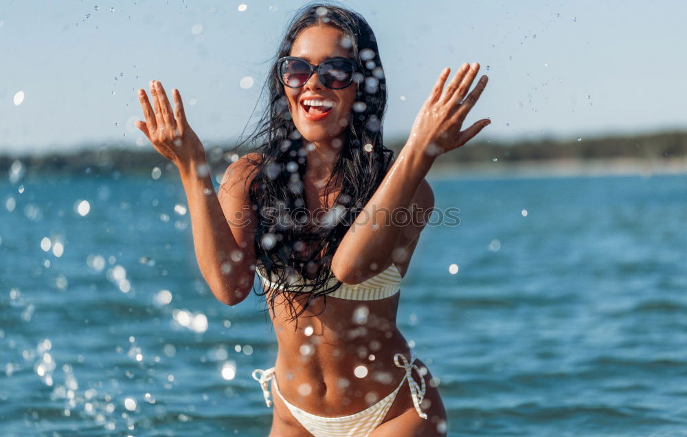 Similar – Image, Stock Photo Woman making peace sign standing in swimming pool