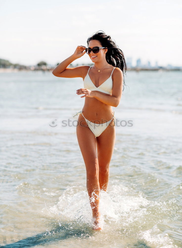 Similar – Woman with beautiful body enjoying her bath on the beach