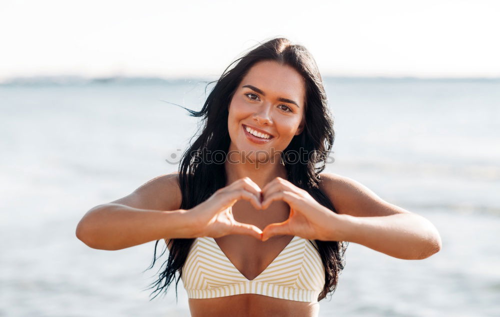 Similar – Image, Stock Photo Beautiful woman with sports clothes, sitting on a concrete wall outdoors at sunset.