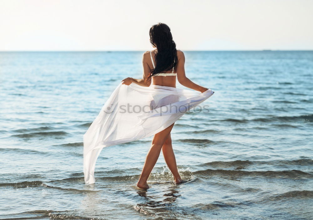 Similar – Image, Stock Photo Pensive woman on the beach