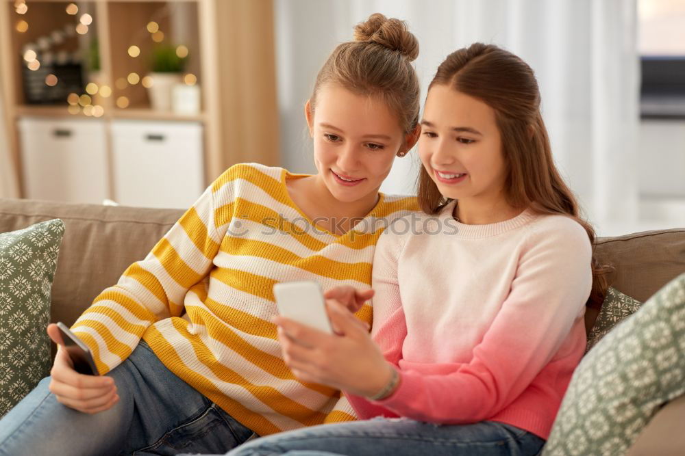 Similar – Image, Stock Photo Girl and boy reading a book sitting on the bed