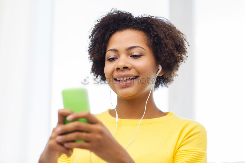 Similar – Black woman listening to the music with headphones