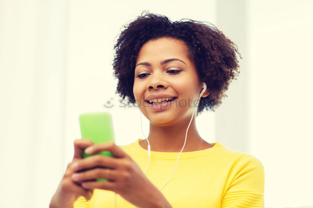 Similar – Black woman listening to the music with headphones