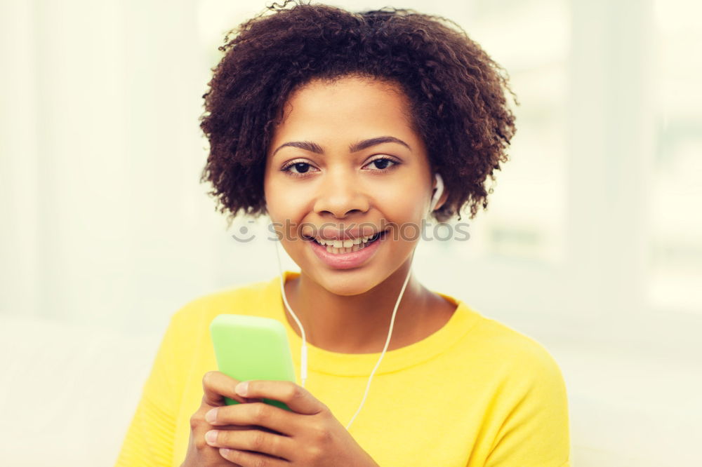 Similar – Black woman listening to the music with headphones