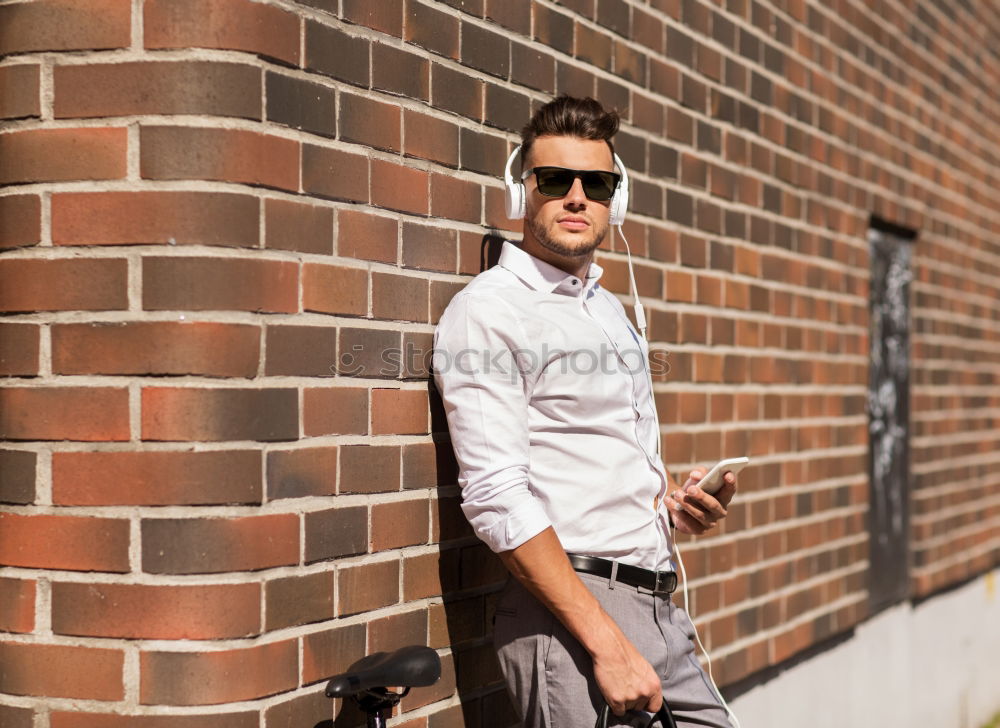 portrait of a happy man use his phone in the market