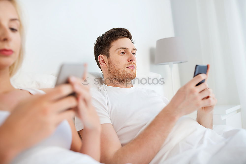 Similar – Image, Stock Photo Couple browsing on online on smartphone at home