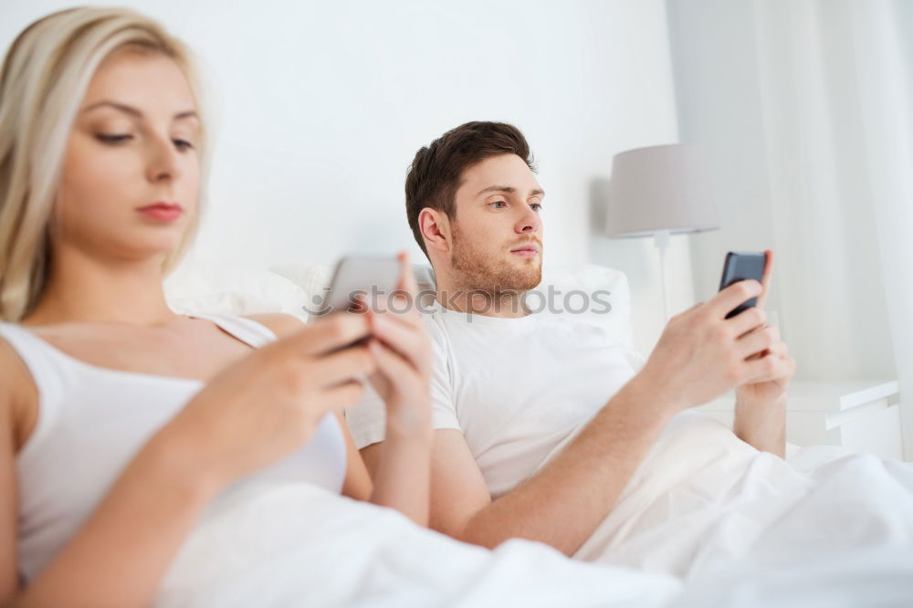 Similar – Image, Stock Photo Couple browsing on online on smartphone at home