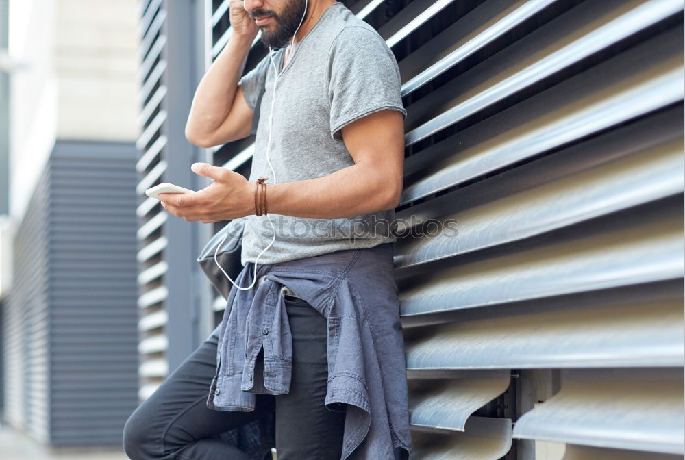 Similar – Young bearded man, model of fashion, sitting on urban step