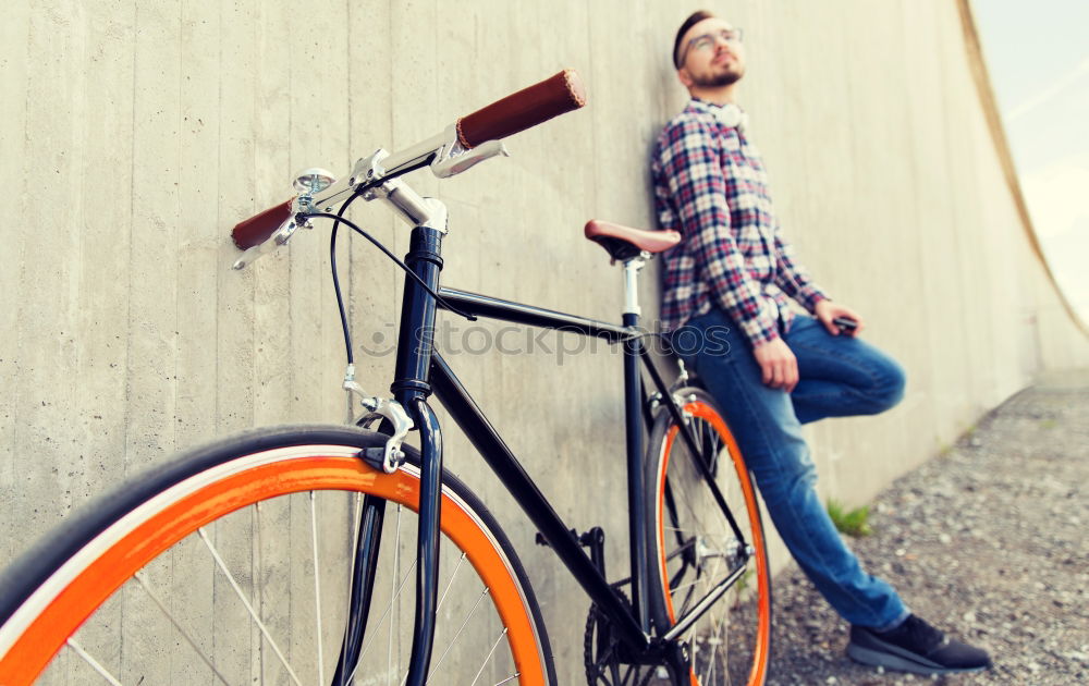 Similar – Sportlicher Mann mit Fahrrad beim Telefonieren