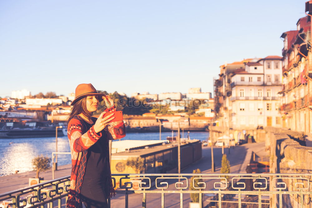 Similar – Stylish woman sitting near bridge in old city