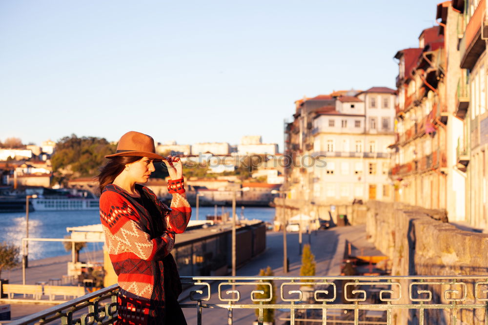 Similar – Stylish woman sitting near bridge in old city