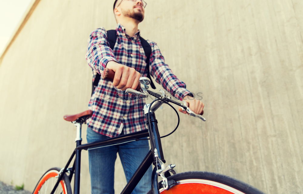 Similar – Sportlicher Mann mit Fahrrad beim Telefonieren