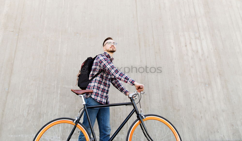 Similar – Handsome afro man relaxing near his bike.