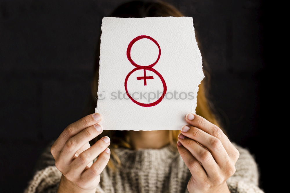 Similar – Young woman with a feminine symbol in her hand