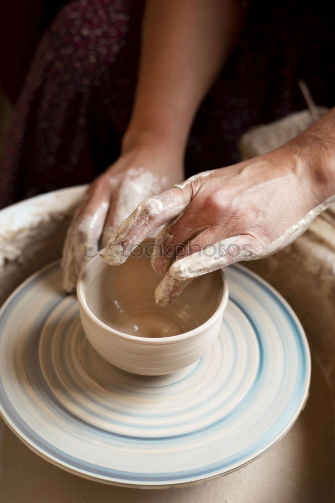 Similar – Image, Stock Photo Potter’s hands making a pot in a traditional style.