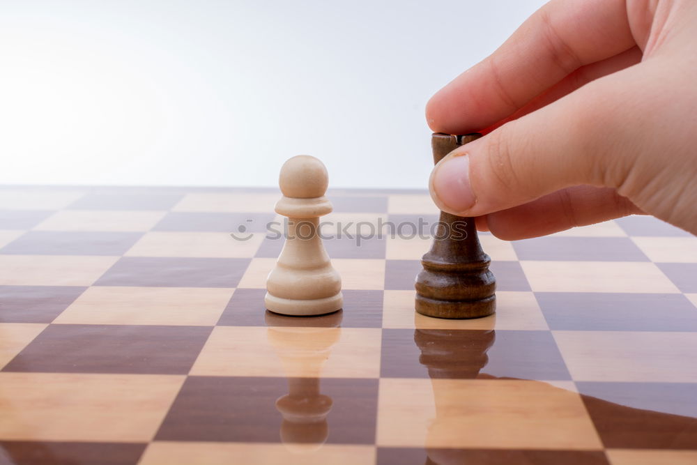 Similar – Girl and boy playing chess at home.