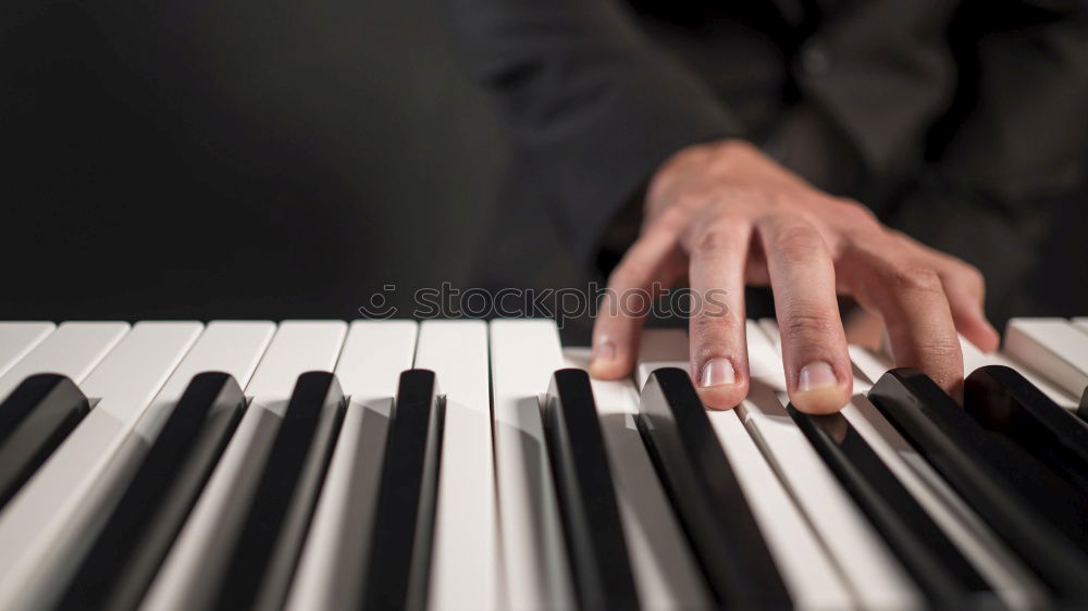 Similar – Image, Stock Photo Close up of hands of person playing piano