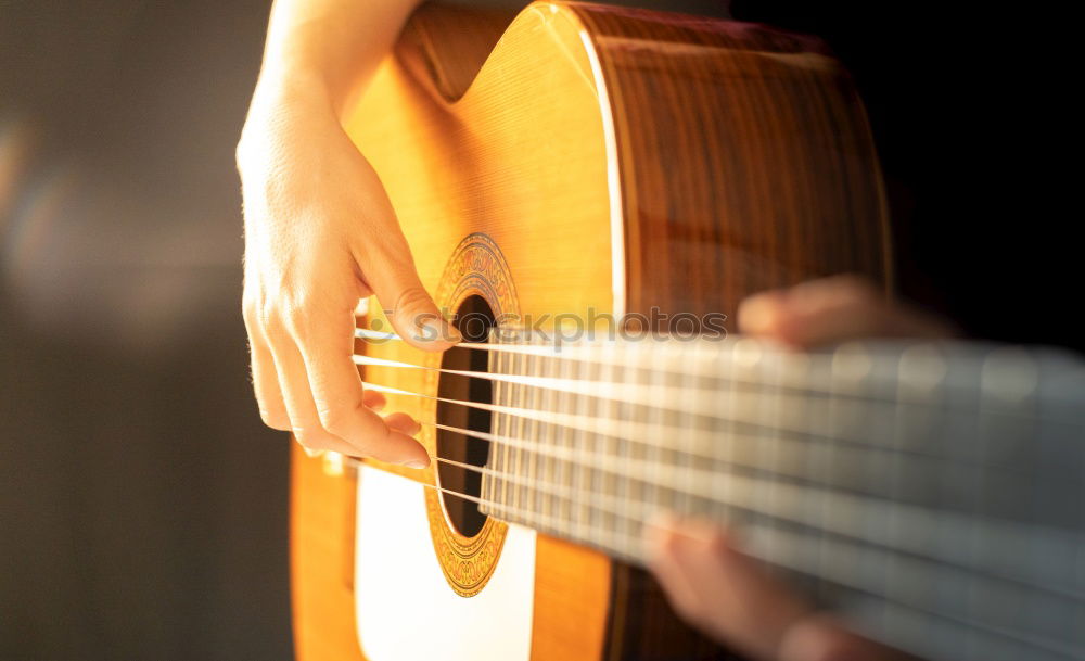 Similar – Image, Stock Photo Man playing guitar and composing music at home near a bright window on a sunny day. Casual musician sitting on the floor playing the guitar.