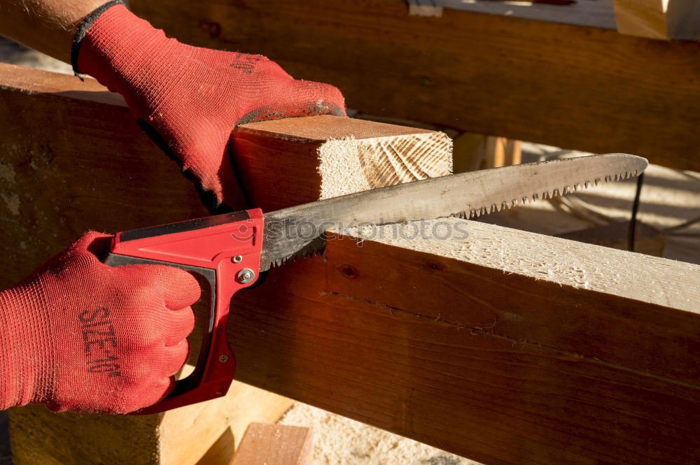 Similar – Blacksmith produces a horseshoe on an anvil with a hammer