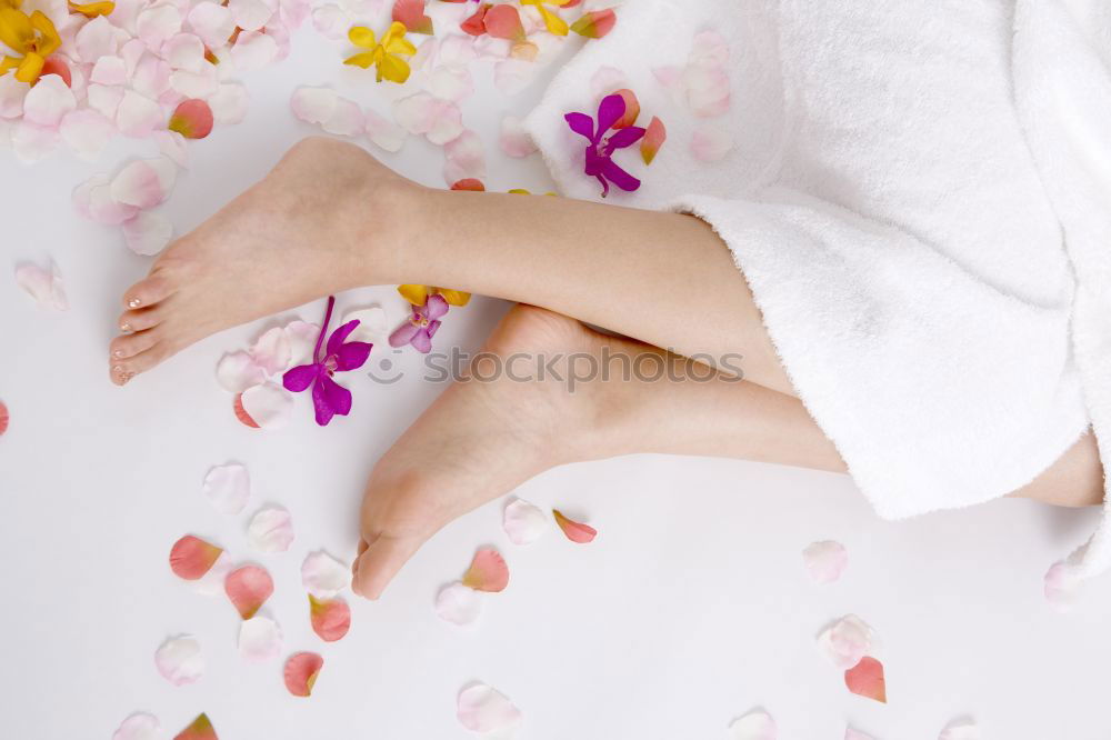 Similar – Woman lying in bathtub filled with flowers and fruits