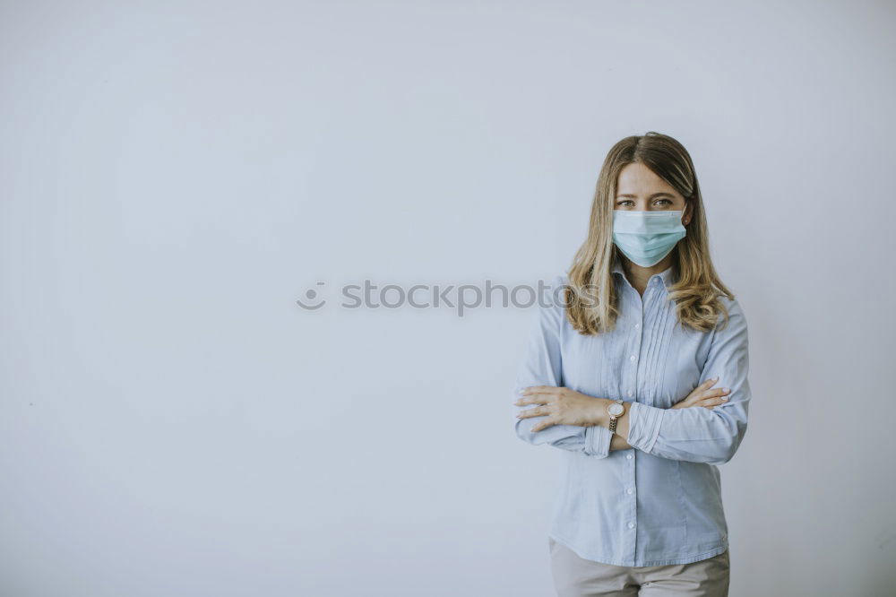 Female teenager in protective mask standing near electric scooter