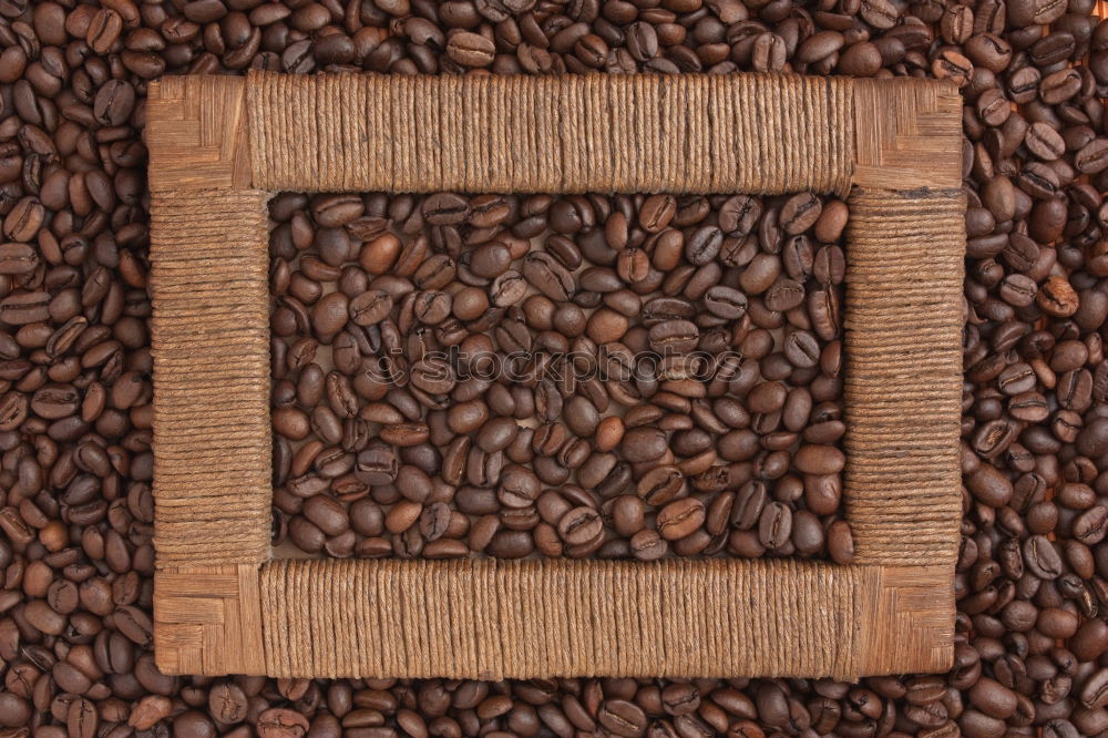 Similar – Coffee beans on wooden table background