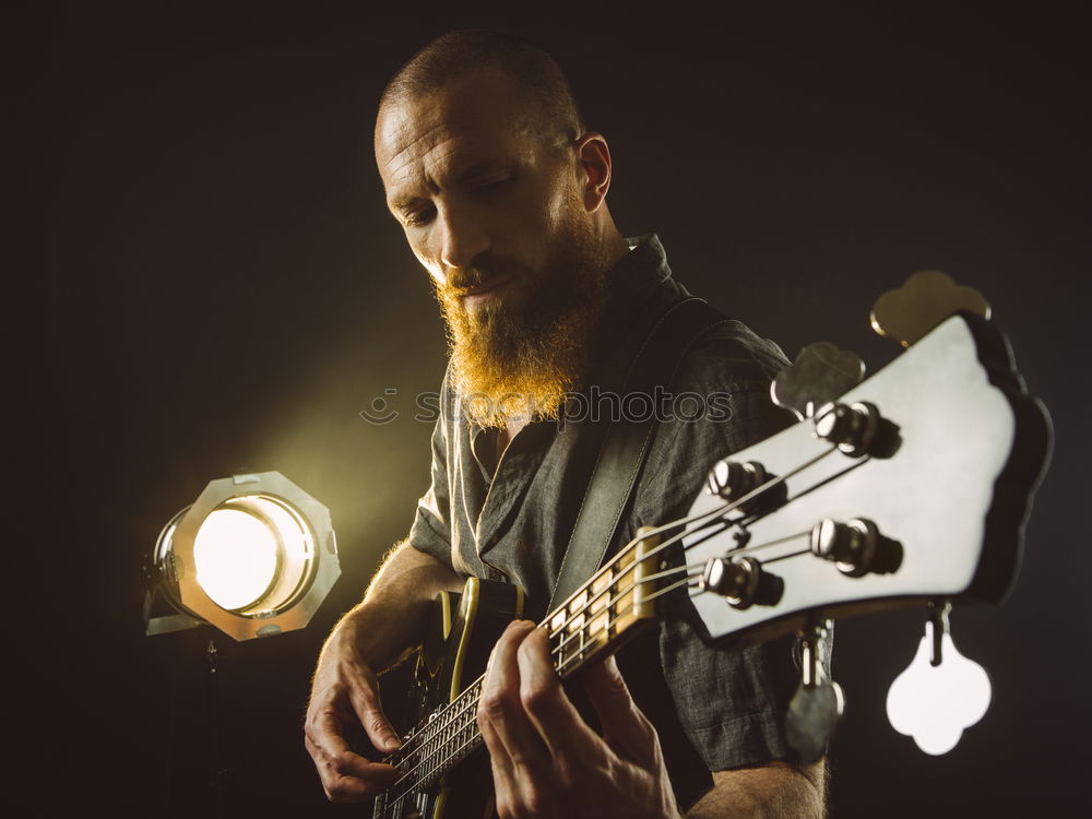 Similar – Image, Stock Photo Guitarist sitting on guitar combo