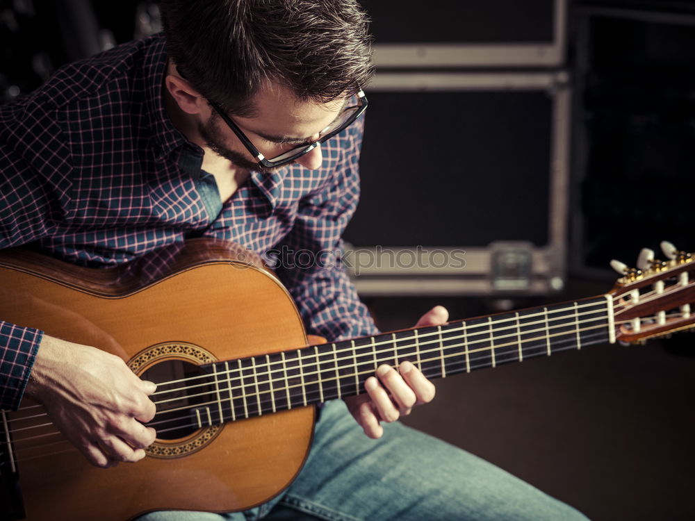 Similar – Image, Stock Photo Guitarist sitting on guitar combo