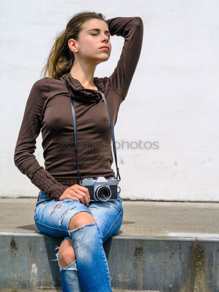 Similar – Woman in Winter Outfit in Front Old Gray Wall