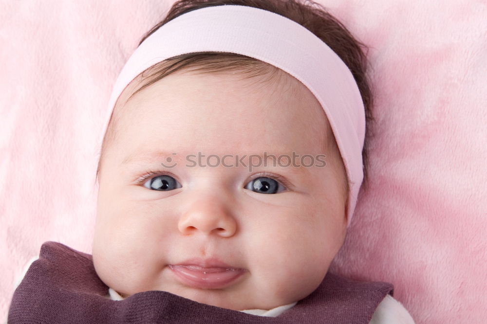 Similar – Baby girl in a bed with toys around.