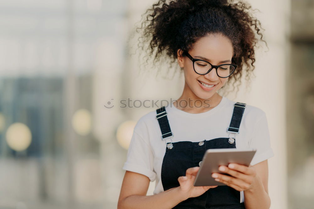 Similar – Black woman listening to the music with headphones