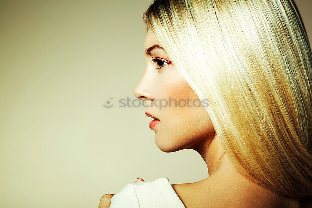 Similar – Profile shot of blonde long haired young woman with light eyes