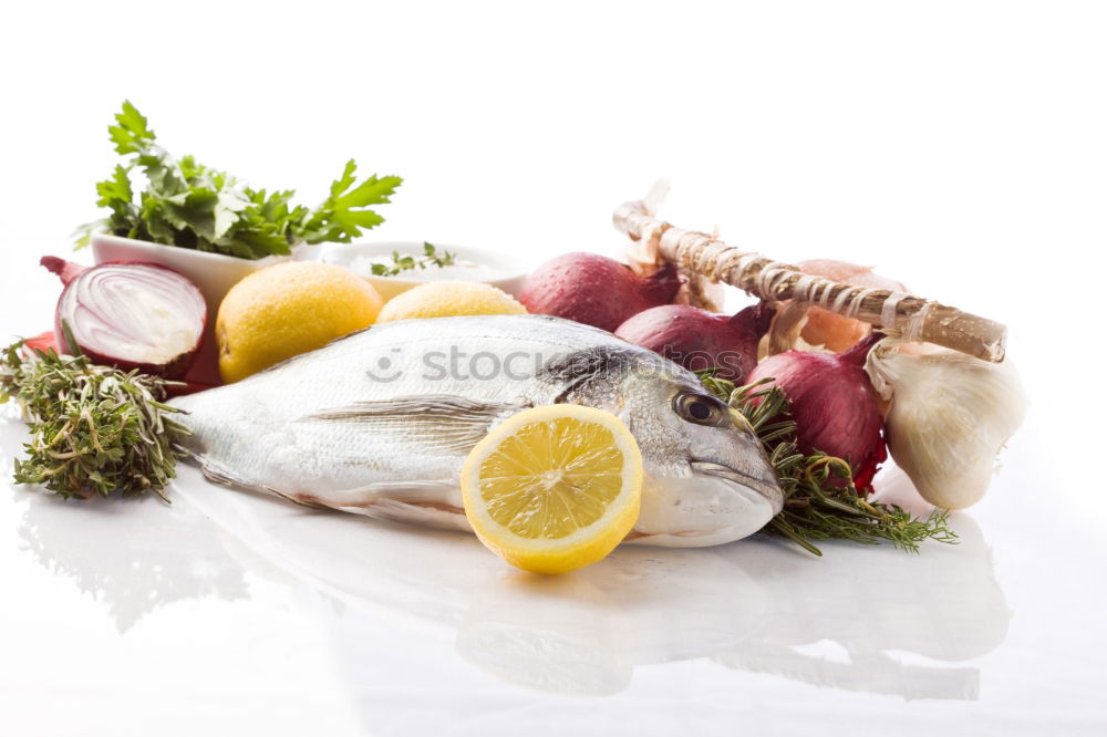 Similar – Red onion and lemon on zander fish