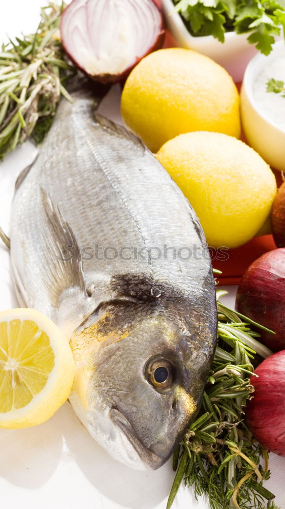 Similar – Dorado fish with ingredients for cooking