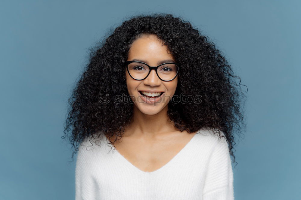 Similar – Young black woman with afro hairstyle smiling.