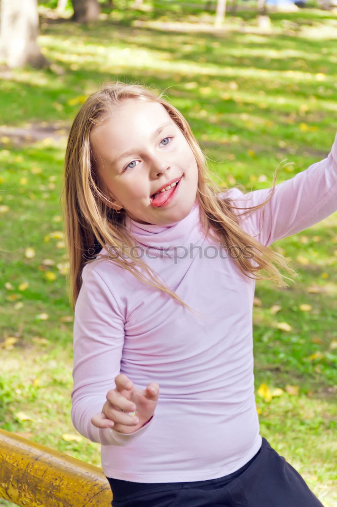 Similar – Woman tying hair in ponytail getting ready for run.