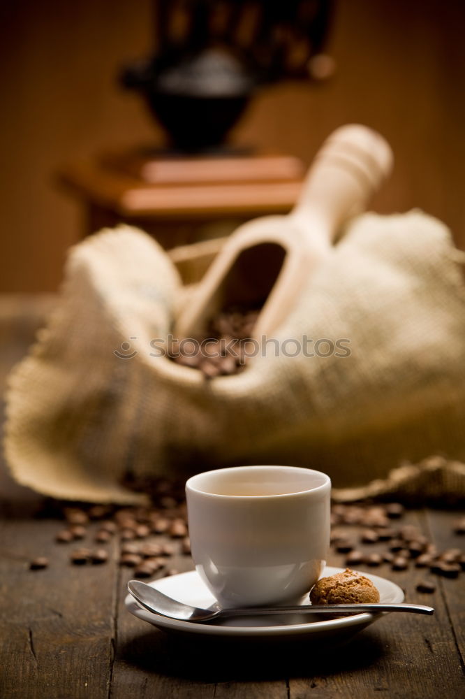 Similar – Cup of coffee on old wooden table with kitchen towel