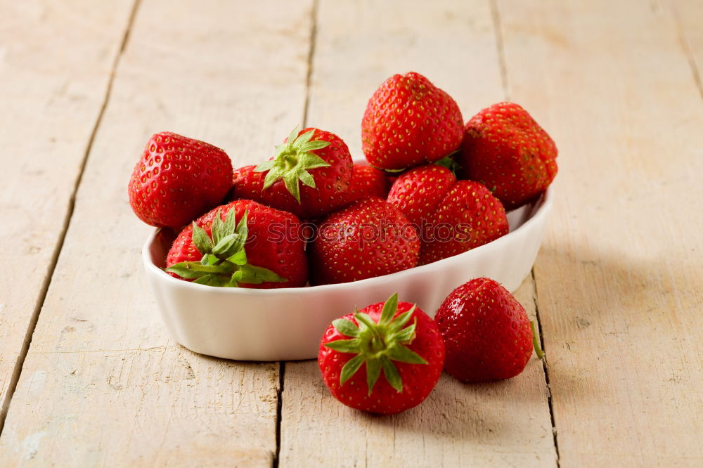 Similar – Strawberries close up on a white wooden table