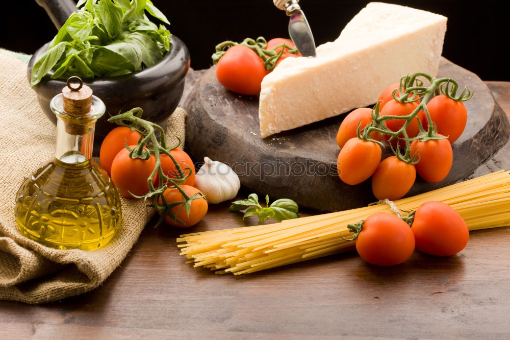 Similar – Image, Stock Photo cutting board with a knife and fresh red cherry tomatoes