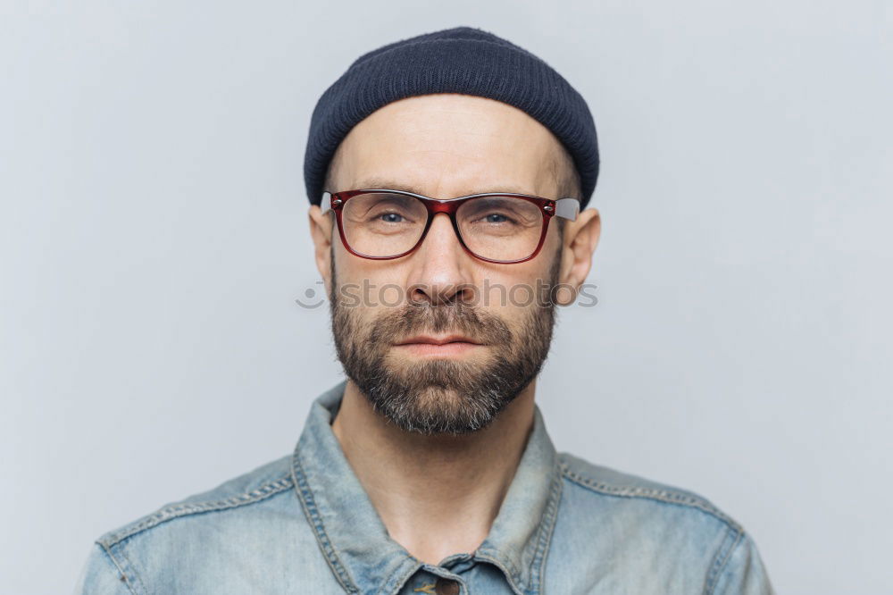 Similar – Man with mustache and glasses standing looking at camera.