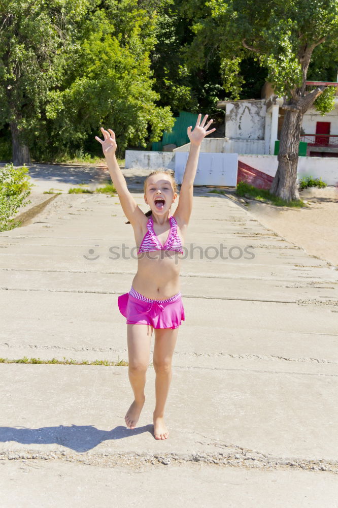 Similar – Playful girl standing in pier near lake