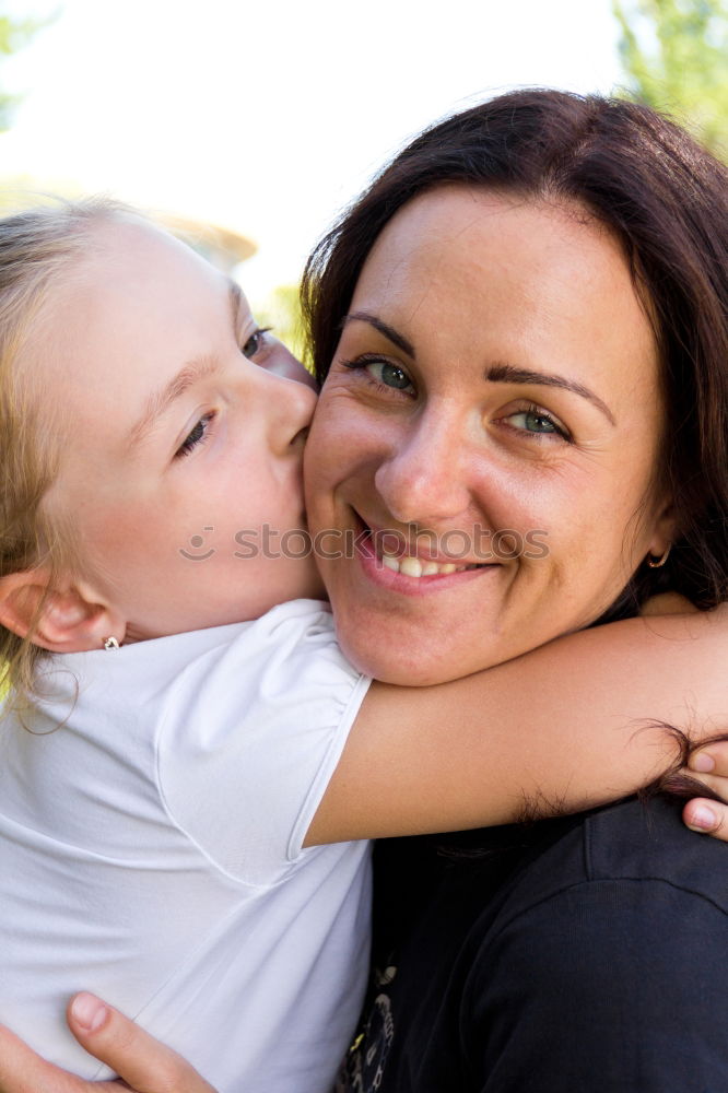 Similar – Kissing mother and daughter in summer