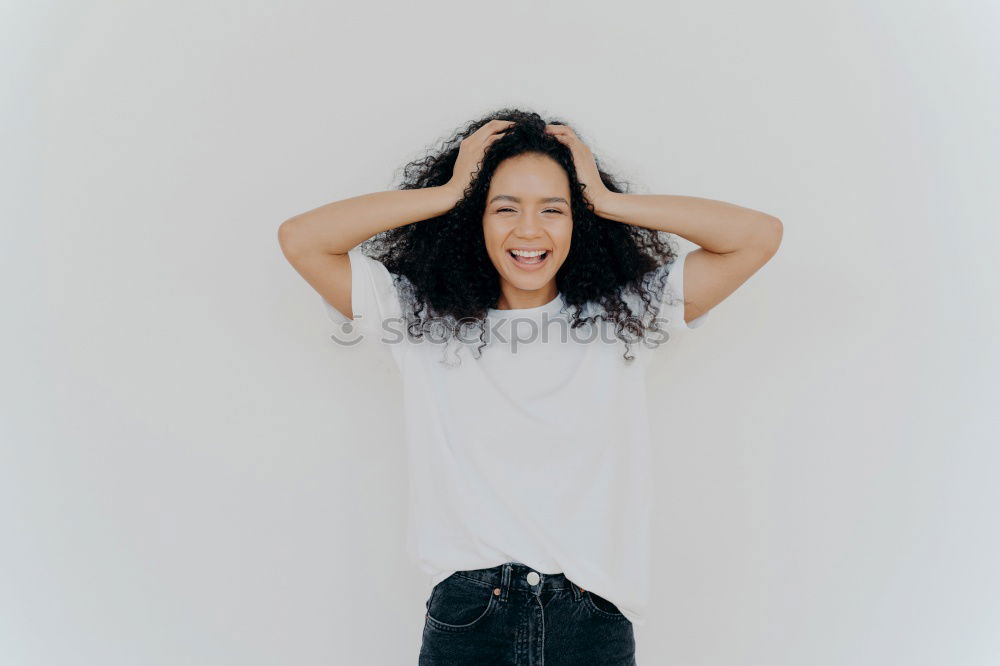 Similar – Young woman leaning on white wall