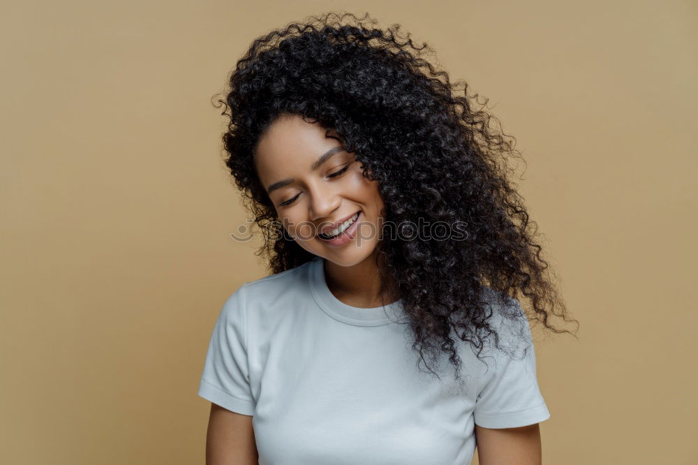 Similar – Young black woman, afro hairstyle, smiling outdoors